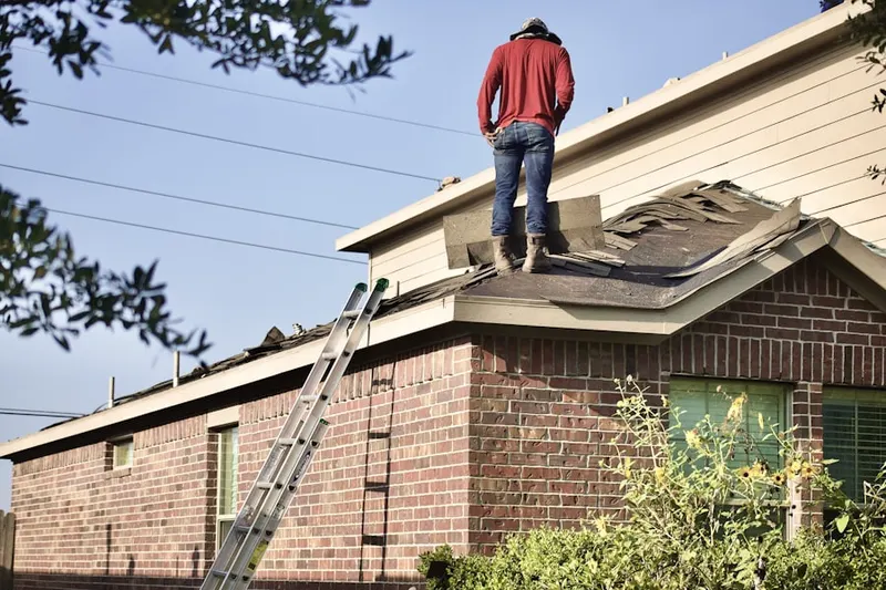 Professional roofer working on a residential roof in Clearview Court